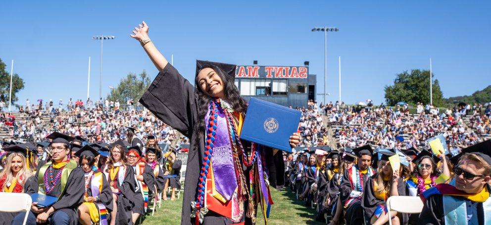 A student celebrating at Saint Mary's College Commencement